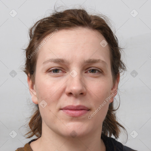 Joyful white young-adult female with medium  brown hair and blue eyes