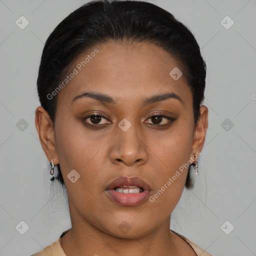 Joyful black young-adult female with short  brown hair and brown eyes