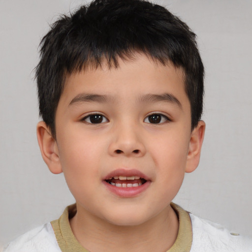 Joyful white child male with short  brown hair and brown eyes