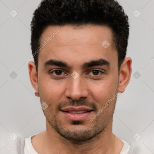 Joyful white young-adult male with short  black hair and brown eyes