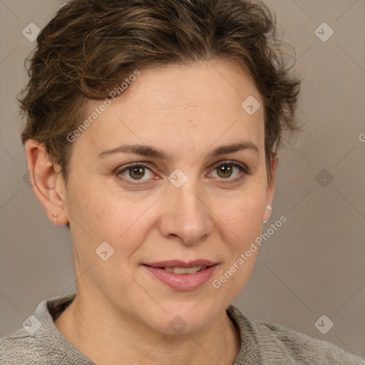 Joyful white adult female with short  brown hair and grey eyes