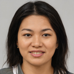 Joyful asian young-adult female with medium  brown hair and brown eyes