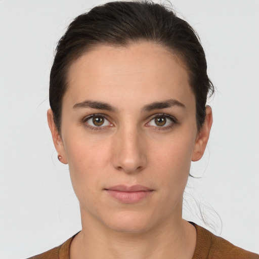 Neutral white young-adult female with short  brown hair and brown eyes