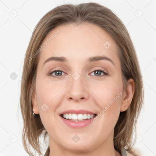 Joyful white young-adult female with medium  brown hair and grey eyes