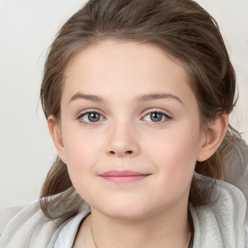 Joyful white child female with medium  brown hair and brown eyes