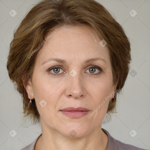 Joyful white adult female with medium  brown hair and grey eyes