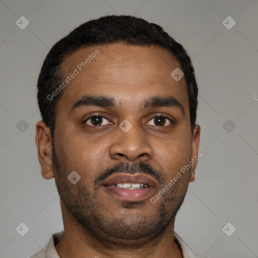 Joyful latino young-adult male with short  brown hair and brown eyes