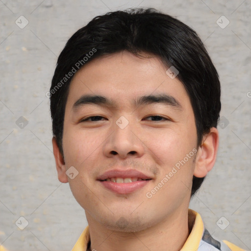 Joyful asian young-adult male with short  black hair and brown eyes