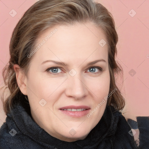 Joyful white young-adult female with long  brown hair and blue eyes