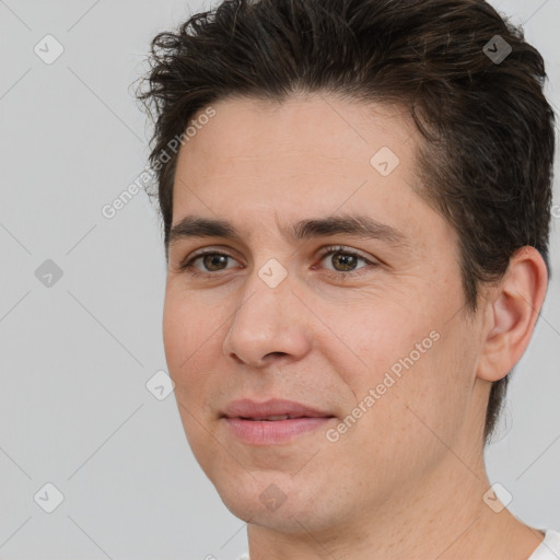 Joyful white adult male with short  brown hair and brown eyes