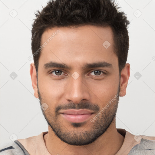 Joyful white young-adult male with short  brown hair and brown eyes