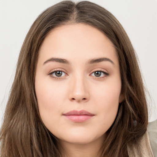 Neutral white young-adult female with long  brown hair and brown eyes