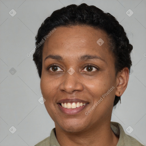 Joyful black adult female with short  black hair and brown eyes