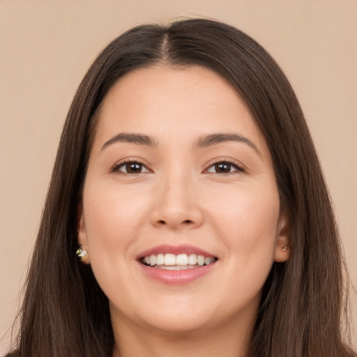 Joyful white young-adult female with long  brown hair and brown eyes