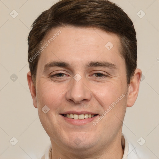 Joyful white adult male with short  brown hair and brown eyes