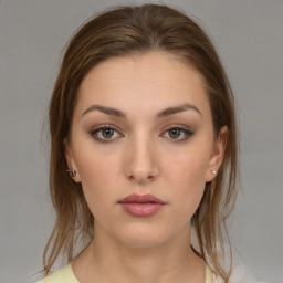 Neutral white young-adult female with medium  brown hair and brown eyes