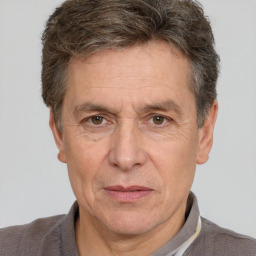 Joyful white middle-aged male with short  brown hair and brown eyes