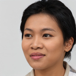 Joyful asian young-adult female with medium  black hair and brown eyes