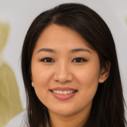 Joyful asian young-adult female with long  brown hair and brown eyes