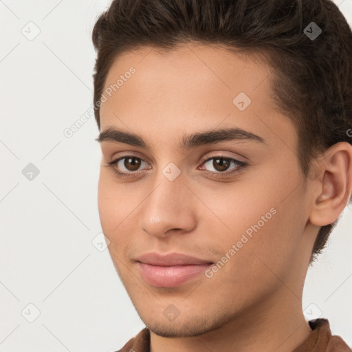 Joyful white young-adult male with short  brown hair and brown eyes