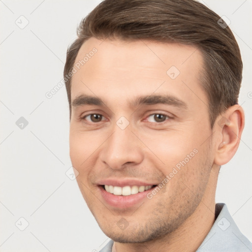 Joyful white young-adult male with short  brown hair and brown eyes