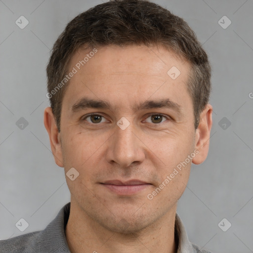 Joyful white adult male with short  brown hair and grey eyes