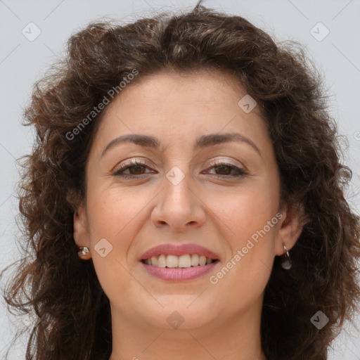 Joyful white adult female with long  brown hair and brown eyes