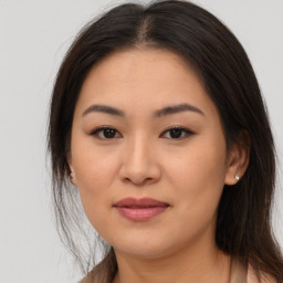 Joyful asian young-adult female with medium  brown hair and brown eyes