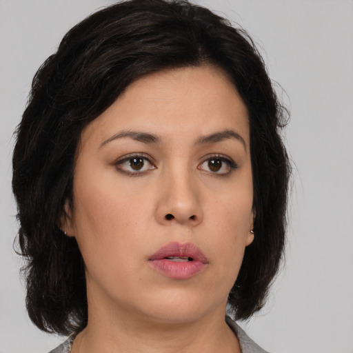 Neutral asian young-adult female with medium  brown hair and brown eyes