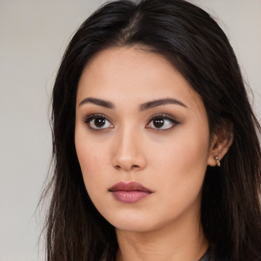 Neutral asian young-adult female with long  brown hair and brown eyes