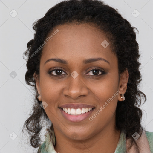 Joyful black young-adult female with long  brown hair and brown eyes