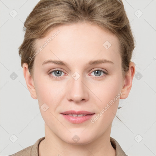 Joyful white young-adult female with short  brown hair and grey eyes