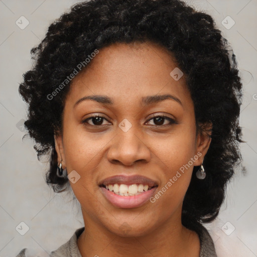 Joyful black young-adult female with long  brown hair and brown eyes