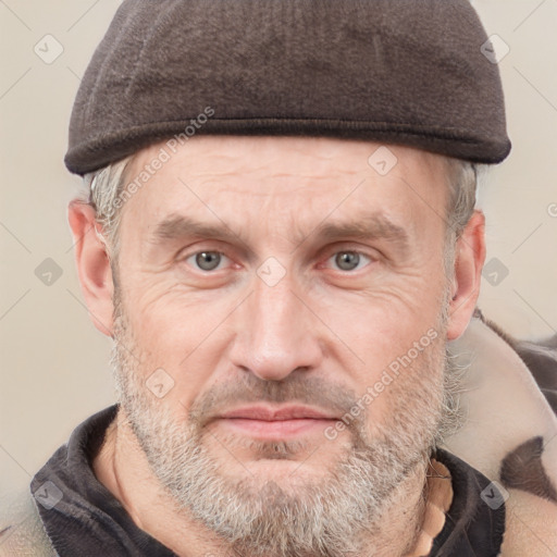 Joyful white adult male with short  brown hair and grey eyes