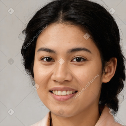 Joyful latino young-adult female with medium  brown hair and brown eyes