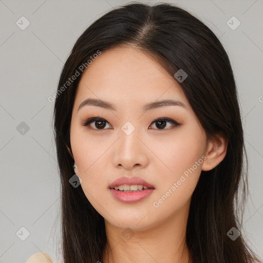 Joyful asian young-adult female with long  brown hair and brown eyes