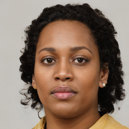 Neutral black young-adult female with long  black hair and brown eyes