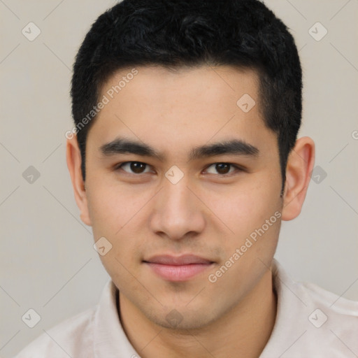 Joyful latino young-adult male with short  brown hair and brown eyes