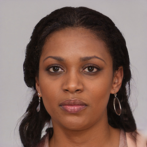 Neutral black young-adult female with medium  black hair and brown eyes
