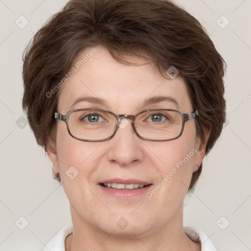 Joyful white adult female with short  brown hair and grey eyes