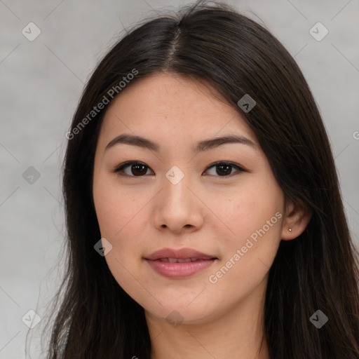 Joyful asian young-adult female with long  brown hair and brown eyes