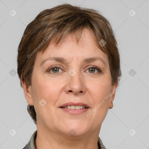 Joyful white adult female with short  brown hair and grey eyes