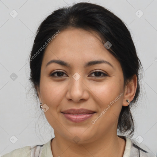 Joyful latino young-adult female with medium  brown hair and brown eyes