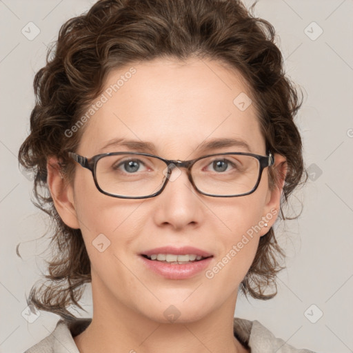 Joyful white adult female with medium  brown hair and blue eyes