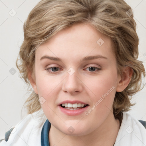 Joyful white young-adult female with medium  brown hair and blue eyes