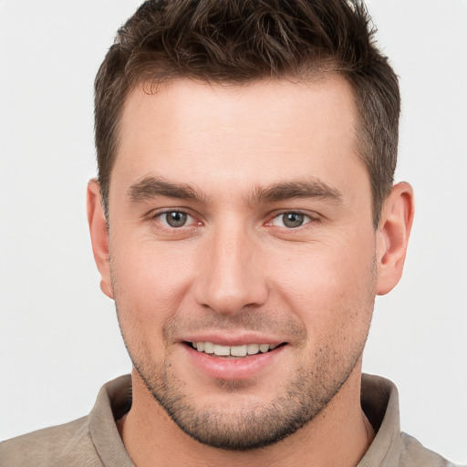 Joyful white young-adult male with short  brown hair and brown eyes