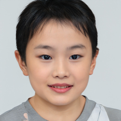 Joyful asian child female with short  brown hair and brown eyes
