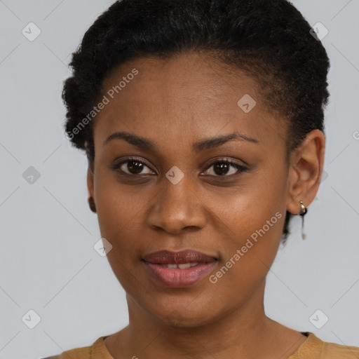 Joyful black young-adult female with short  brown hair and brown eyes