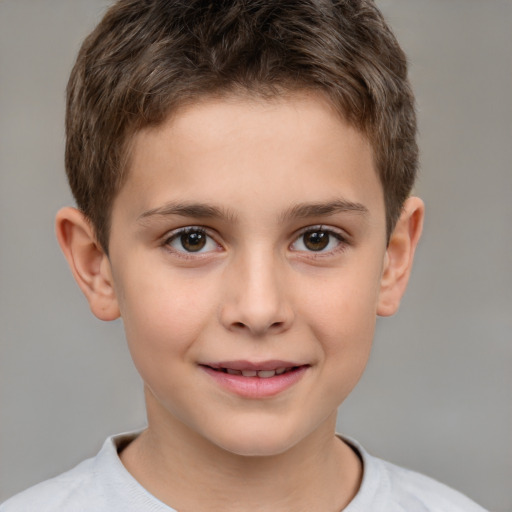 Joyful white child male with short  brown hair and brown eyes