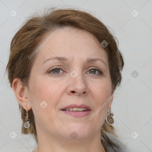 Joyful white adult female with medium  brown hair and grey eyes